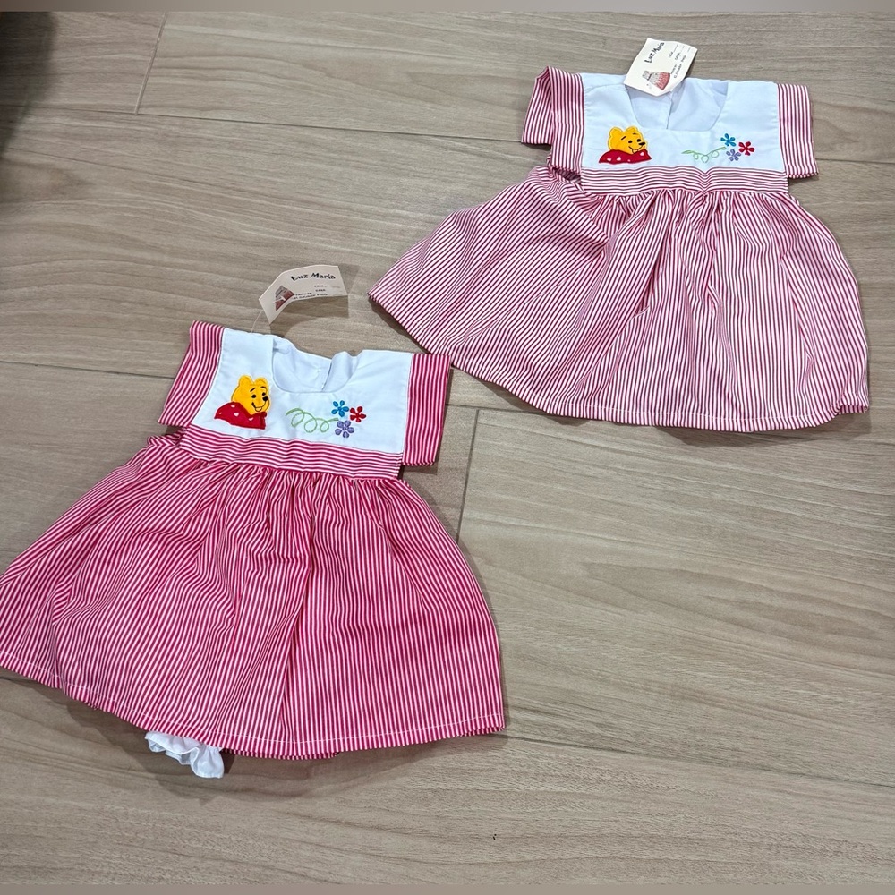 Twins Winnie The Pooh Dresses size isn’t on items I believe they are 6-9 month